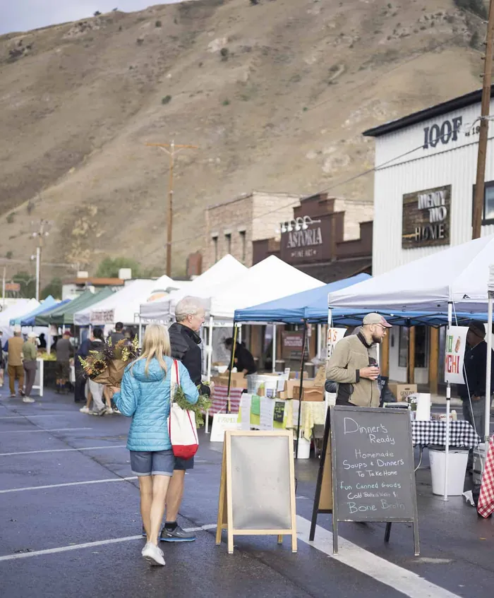 A summer street market with canopies below the hillside in Jackson