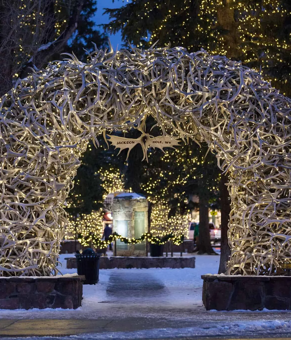 The elk-antler arch on Jackson Town Square, lit up on a snowy winter night